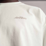 Gesticktes Tellem logo vom weißen TELLEM Longsleeve aus 100 % Baumwolle