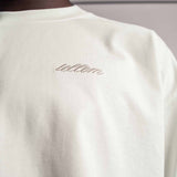 Gesticktes Tellem logo vom weißen TELLEM Longsleeve aus 100 % Baumwolle